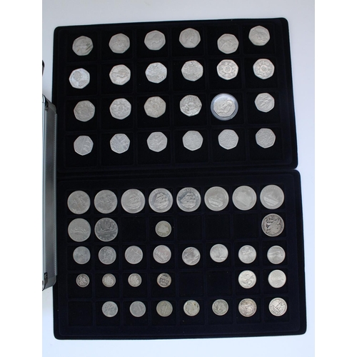 151 - Aluminium coin carry case containing five trays of collectable £1, £2, 50p, mixed pre-decimal US and... 