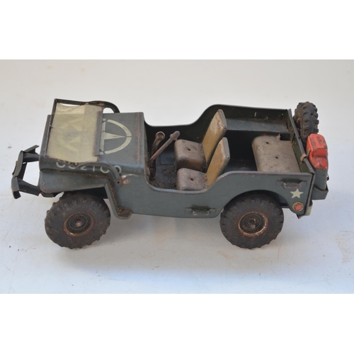 262 - Vintage Arnold tinplate US Army Jeep model, friction power mechanism not working, missing steering w... 