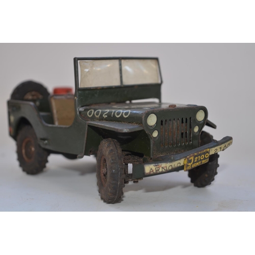 262 - Vintage Arnold tinplate US Army Jeep model, friction power mechanism not working, missing steering w... 