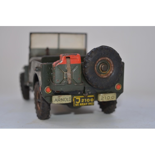 262 - Vintage Arnold tinplate US Army Jeep model, friction power mechanism not working, missing steering w... 