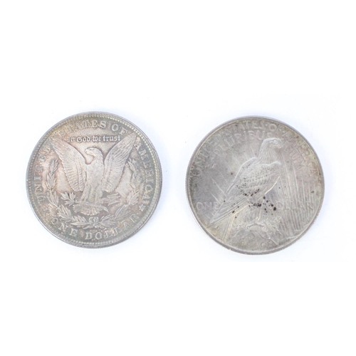 205 - 1887 US silver Morgan dollar $1 USD together with a 1923 US silver Liberty dollar $1 USD