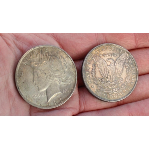 205 - 1887 US silver Morgan dollar $1 USD together with a 1923 US silver Liberty dollar $1 USD