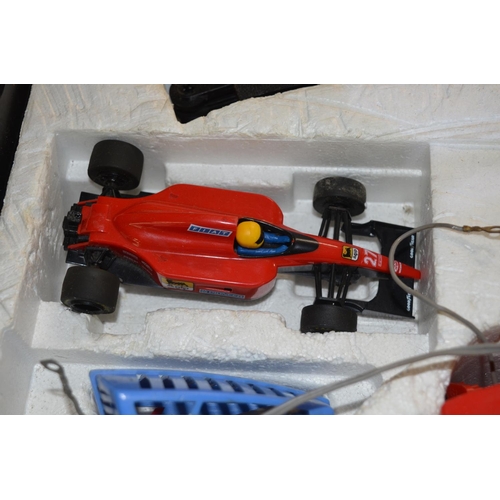 64 - Scalextric set with two cars (both damaged), four hand controllers and selection of track (A/F)