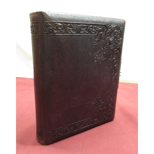 551 - Late Victorian embossed leather photograph album containing carte de visite photographs and cabinet ... 