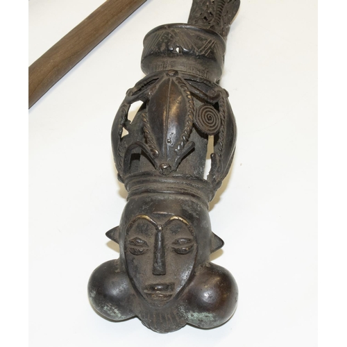 347 - African (Cameroon): cast metal figural tribal ceremonial pipe, L54cm, and two knobkerries/clubs, max... 