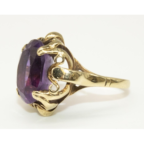 8 - Late C20th 9ct yellow gold ring set with oval cut amethyst, stamped 375, M1/2, 5.0g