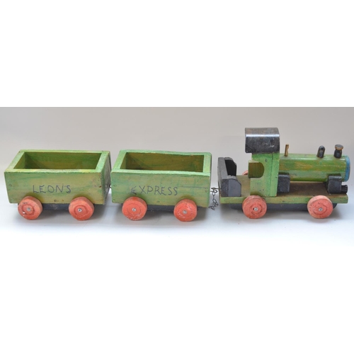 476 - Large homemade child's train model, with two Leon's Express wagons, overall approx L95cm