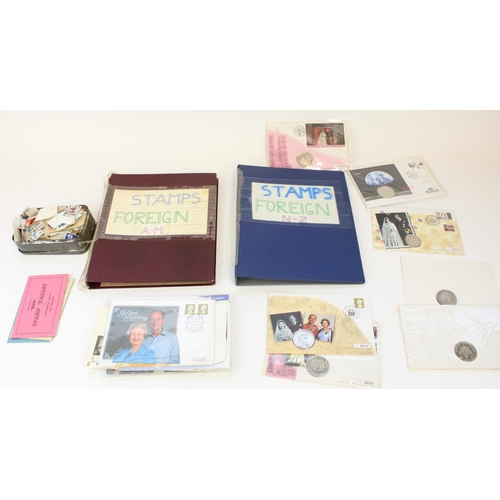 113 - Two folders of world stamps, small selection of FDCs and commemorative coin covers