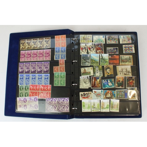 124 - Two stamp albums of GB and world defins. and commems, mint and used together with a small album of w... 