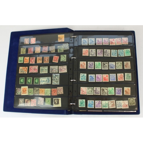 124 - Two stamp albums of GB and world defins. and commems, mint and used together with a small album of w... 