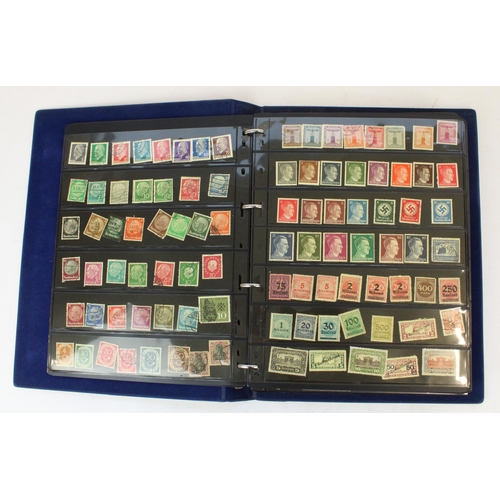 124 - Two stamp albums of GB and world defins. and commems, mint and used together with a small album of w... 