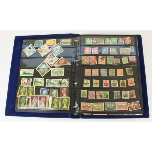 124 - Two stamp albums of GB and world defins. and commems, mint and used together with a small album of w... 