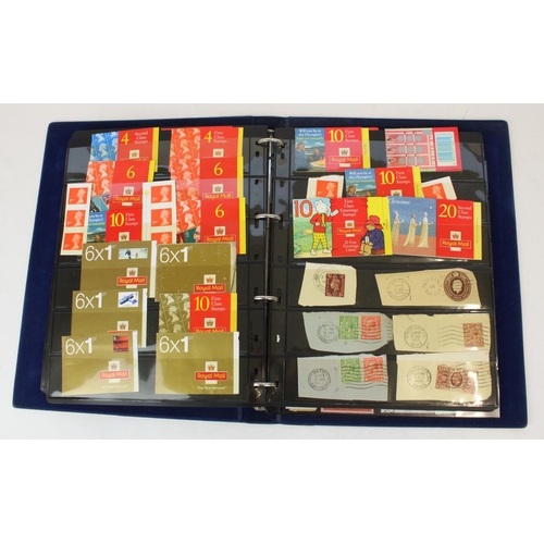 124 - Two stamp albums of GB and world defins. and commems, mint and used together with a small album of w... 