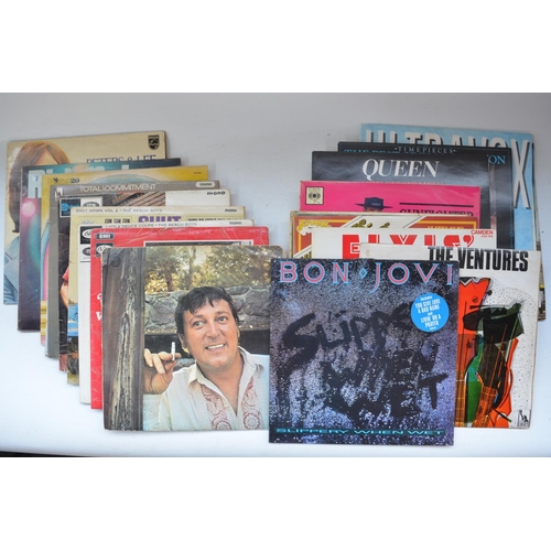 492 - Collection of musical CDs and vinyl records including folders of singles. Artists include Queen, Elv... 