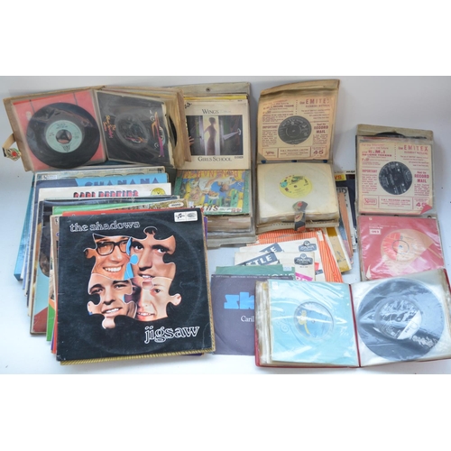 492 - Collection of musical CDs and vinyl records including folders of singles. Artists include Queen, Elv... 