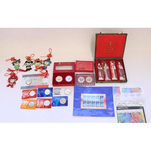 132 - Selection of world commemorative coin packs, mostly Olympics related covering Australia 2000 Sydney ... 