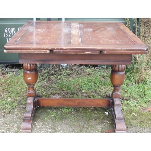 719 - C20th oak finish draw leaf dining table, a pair of Victorian oak framed dining chairs, and a pitch p... 