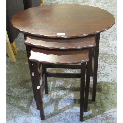 721 - C20th nest of three mahogany occasional tables, with scalloped edges, largest W59cm D41cm H57cm