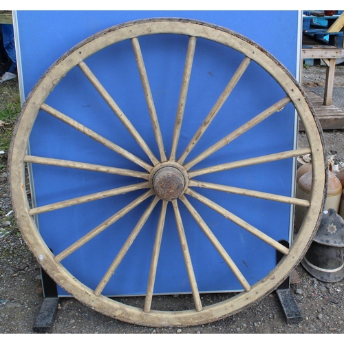 794 - Pair of large wooden cartwheels with axle and hubs with metal rims, W135cm