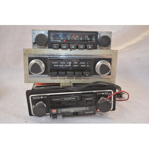 147 - Three vintage car radios incl. Blaupunkt and Motorola (radio only), a Sharp radio cassette player wi... 