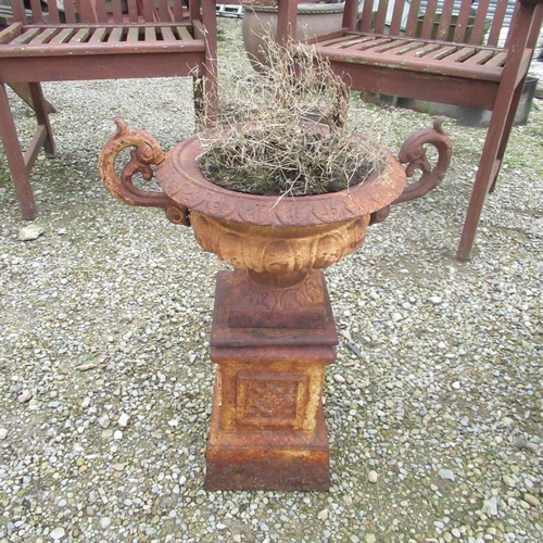 782 - Small weathered cast iron garden urn on plinth, H32cm