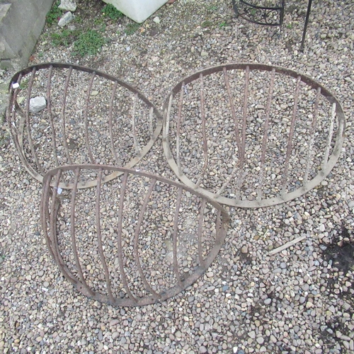 788 - Three cast iron wall mounted hayracks (AF)