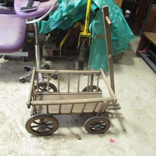 793 - C20th pull along child's cart with three wheels L65cm