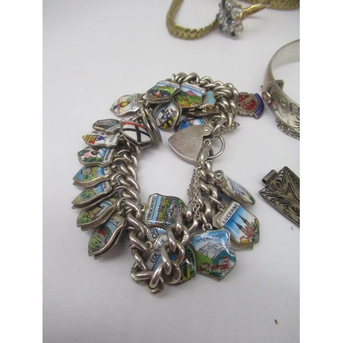19 - Silver charm bracelet with approx. 17 silver and white metal charms, most stamped Sterling, 800, 835... 