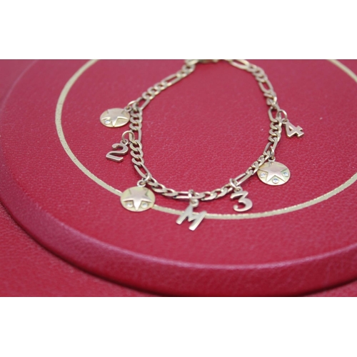 35 - 9ct yellow gold chain link bracelet, clasp stamped 375, with attached yellow metal charms, gross 7.9... 