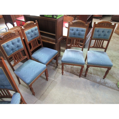 689 - Pair of Victorian walnut framed salon open arm chairs with carved cresting on turned supports with c... 