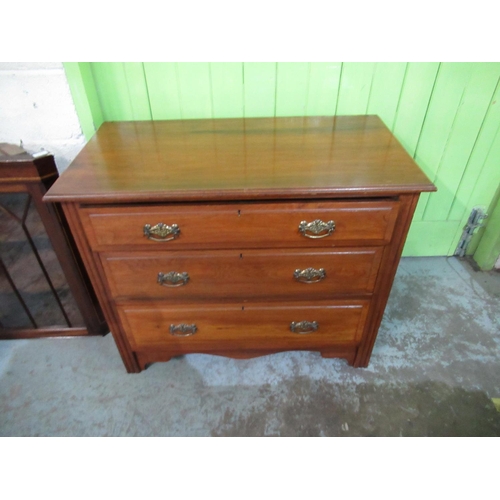 693 - Victorian Walnut chest of three long drawers with brass handles W91cm X D48cm X H76cm