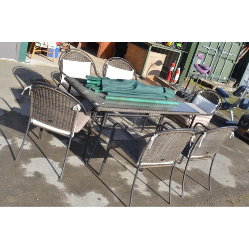 766 - Modern rattan style conservatory/garden table glass top with parasol and six chairs (8)