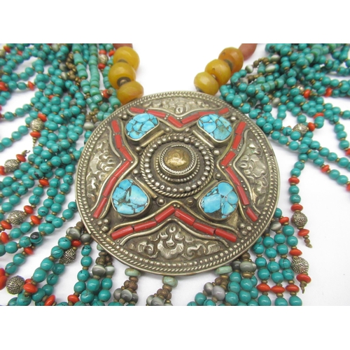 43 - Tibetan white metal necklace set with turquoise and coloured beads, a similar bracelet and a jade ba... 