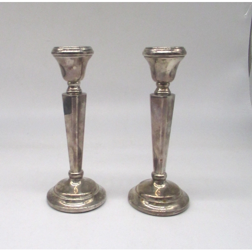 62 - Pair of ER.II hallmarked Sterling silver candlesticks, tapering column on weighted base, by Sanders ... 