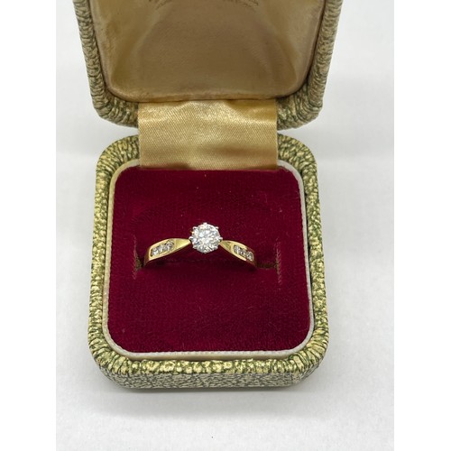 2 - 18ct yellow gold diamond solitaire ring with diamond set shoulders, stamped 750, size M, 2.9g