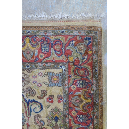 311 - Multicoloured Persian style rug, floral field on ivory ground within red repeating border W160cm x H... 