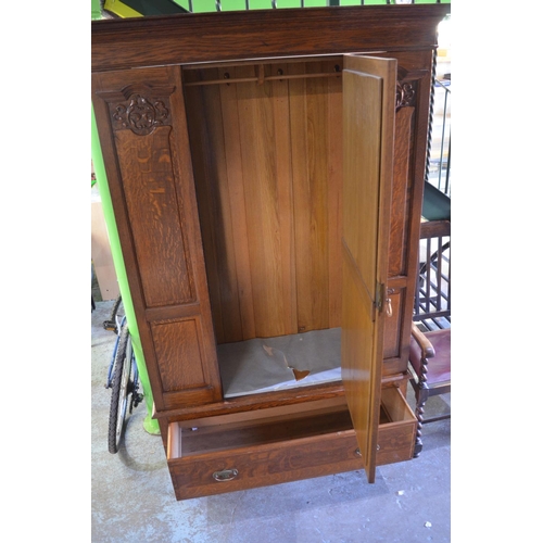 681 - C20th oak wardrobe, mirror door enclosed by carved panels and single drawer on turned supports W130c... 