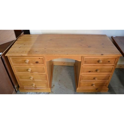 695 - Modern pine kneehole desk, moulded top above six drawers with turn wooden handles on plinth base W14... 