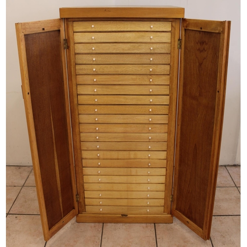 1195 - C20th light oak collectors specimen cabinet, twenty one glazed drawers containing a large collection... 