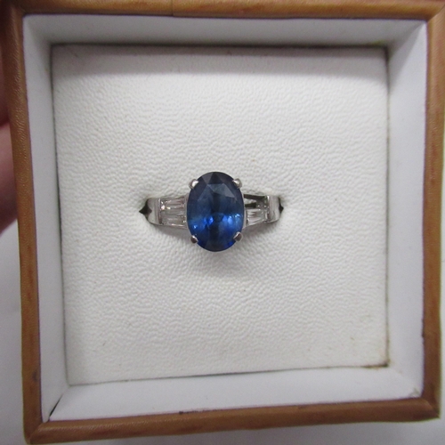 1003 - WITHDRAWN - 18ct white gold sapphire and diamond ring, the central oval cut sapphire (Un-heated, nat... 