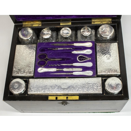 1057 - Fisher 188 Strand - Victorian coromandel dressing box, the ten glass bottles with hallmarked silver ... 