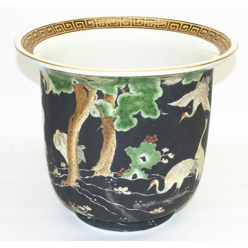 1078 - Chinese export style jardiniere, the bell shaped body polychrome decorated with exotic birds in wood... 