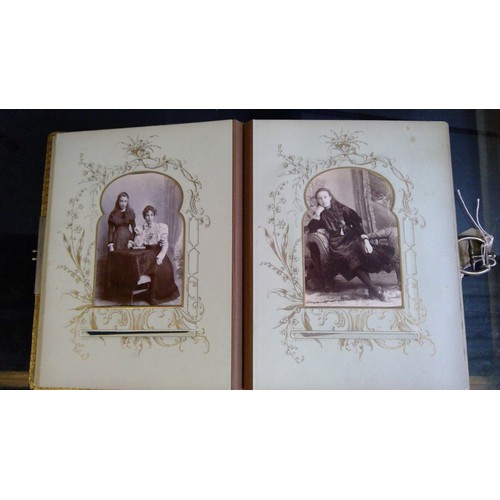 551 - Late Victorian embossed leather photograph album containing carte de visite photographs and cabinet ... 