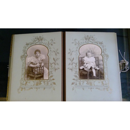 551 - Late Victorian embossed leather photograph album containing carte de visite photographs and cabinet ... 