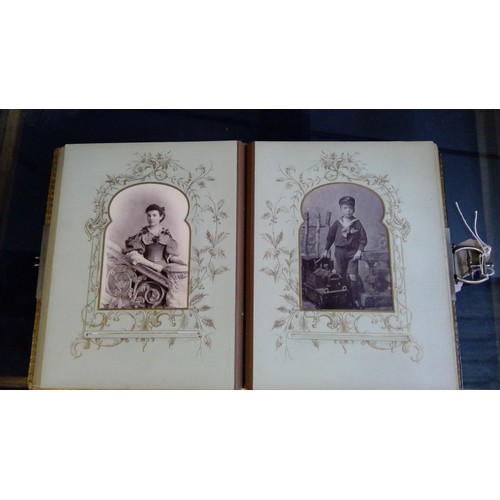 551 - Late Victorian embossed leather photograph album containing carte de visite photographs and cabinet ... 