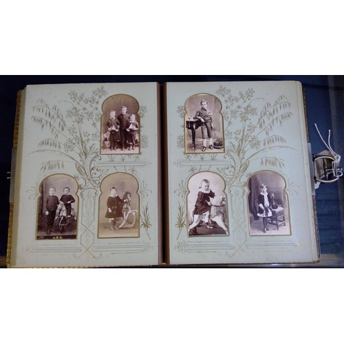 551 - Late Victorian embossed leather photograph album containing carte de visite photographs and cabinet ... 