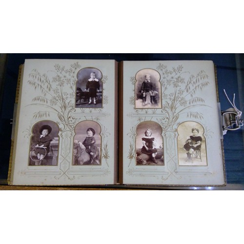 551 - Late Victorian embossed leather photograph album containing carte de visite photographs and cabinet ... 