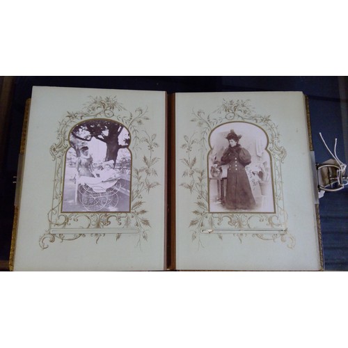 551 - Late Victorian embossed leather photograph album containing carte de visite photographs and cabinet ... 