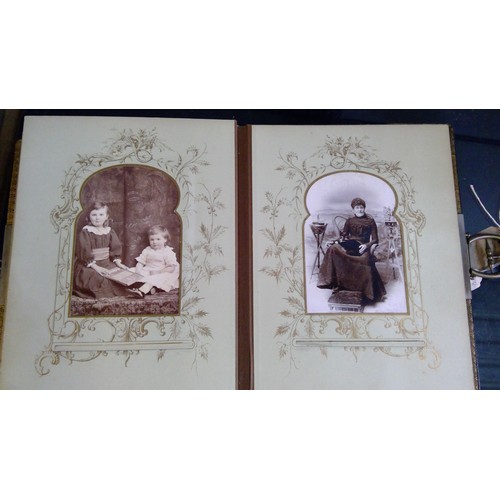 551 - Late Victorian embossed leather photograph album containing carte de visite photographs and cabinet ... 