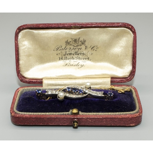 1039 - Yellow and white metal bar brooch set with five round cut sapphires, diamonds and pearls, 
engraved ... 